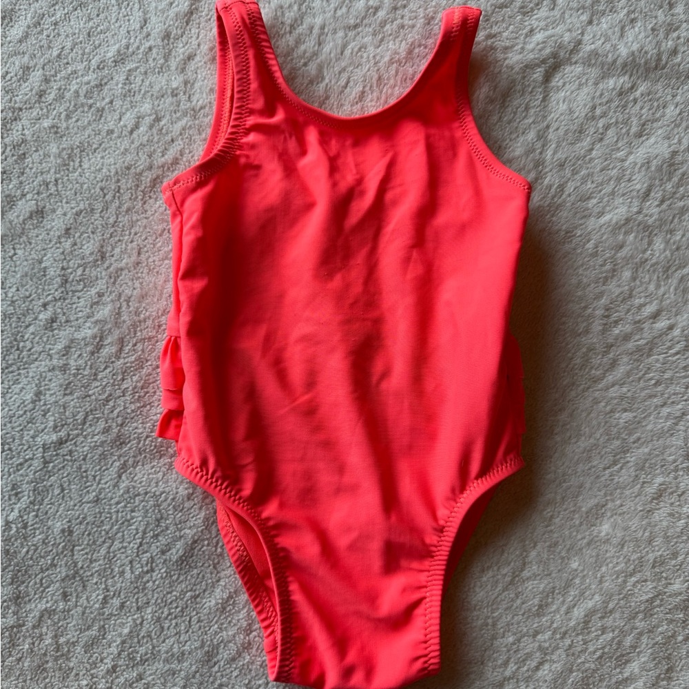 Baby’s vibrant coral One-Piece ruffle Swimsuit